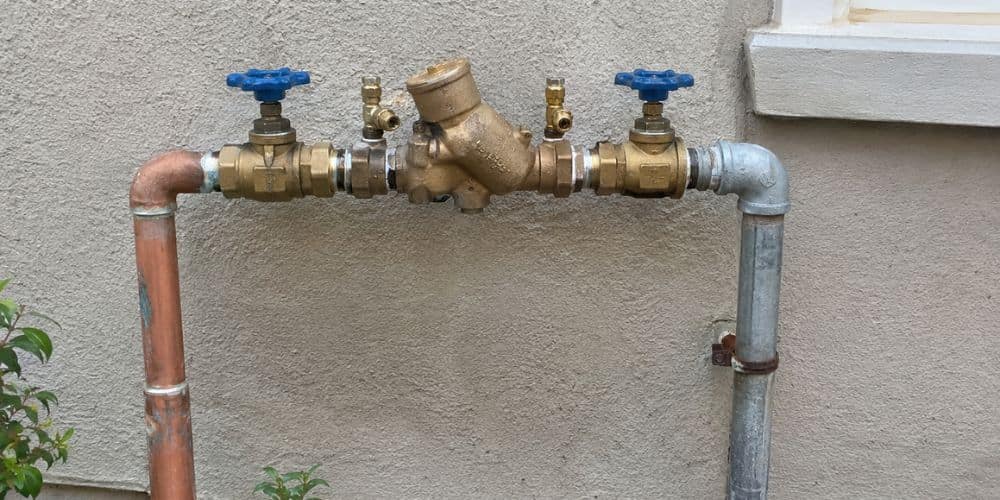 Inspect the Backflow Preventer and Exposed Pipes